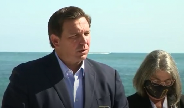 Governor DeSantis, joined by Mayor Daniella Levine Cava, speaking at a press conference in Key Biscayne, FL